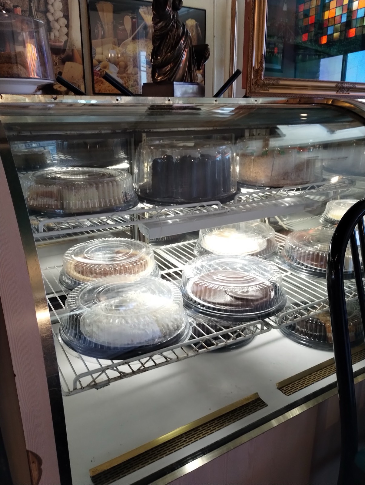 Dessert display case with homemade cakes and pies
