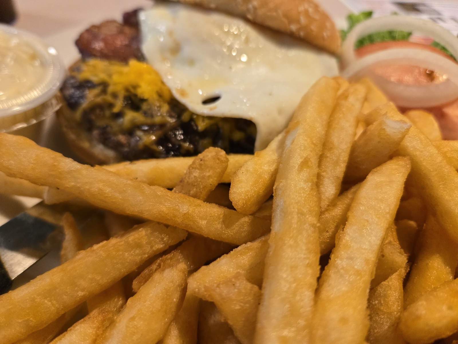Cheeseburger with a basket of french fries